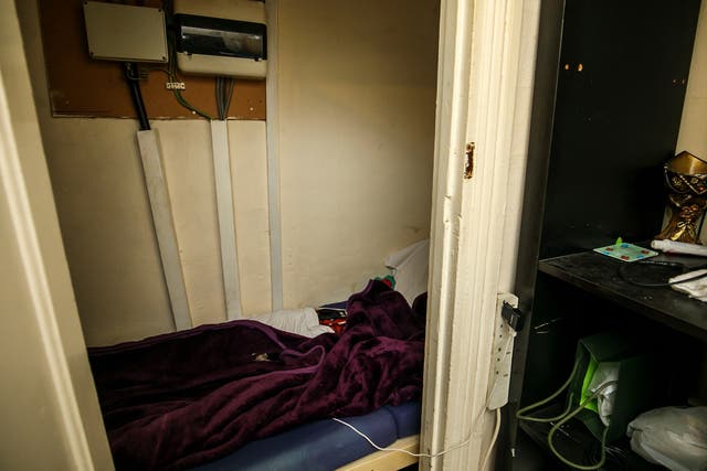 The "coffin-like" understairs cupboard was being used as a room in the crowded house in Beckton