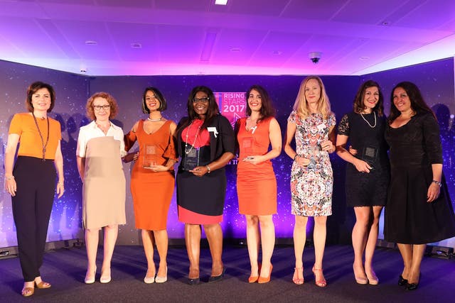 Ms Kamar, fourth from right, receives a rising star award from WeAreTheCity, an organisation supporting women 