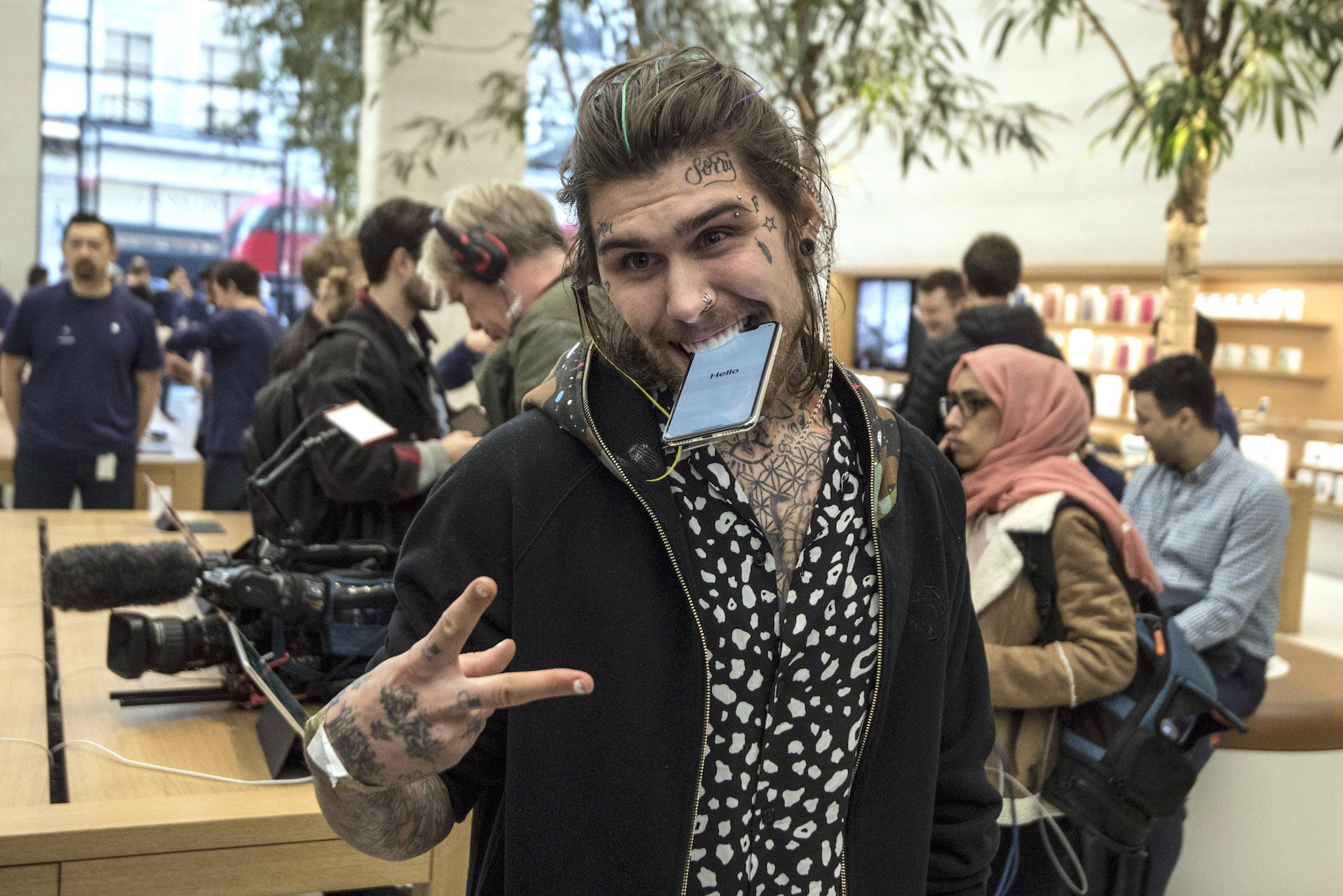 Marco Pierre White Jr poses with an iPhone X after being the first to buy one upon its release in the U.K, on November 3, 2017 in London, England. The iPhone X is positioned as a high-end, model intended to showcase advanced technologies such as wireless charging, OLED display, dual cameras and a face recognition unlock system