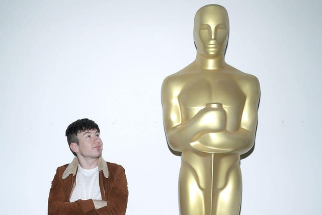 Barry Keoghan alongside a large Oscar statuette