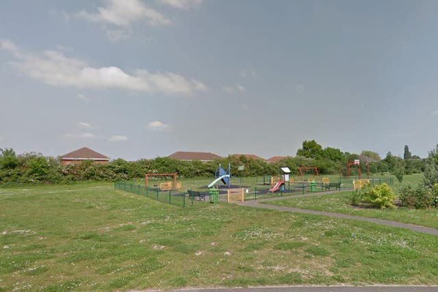 The woman was attacked as she walked her dog through a park in Winnersh
