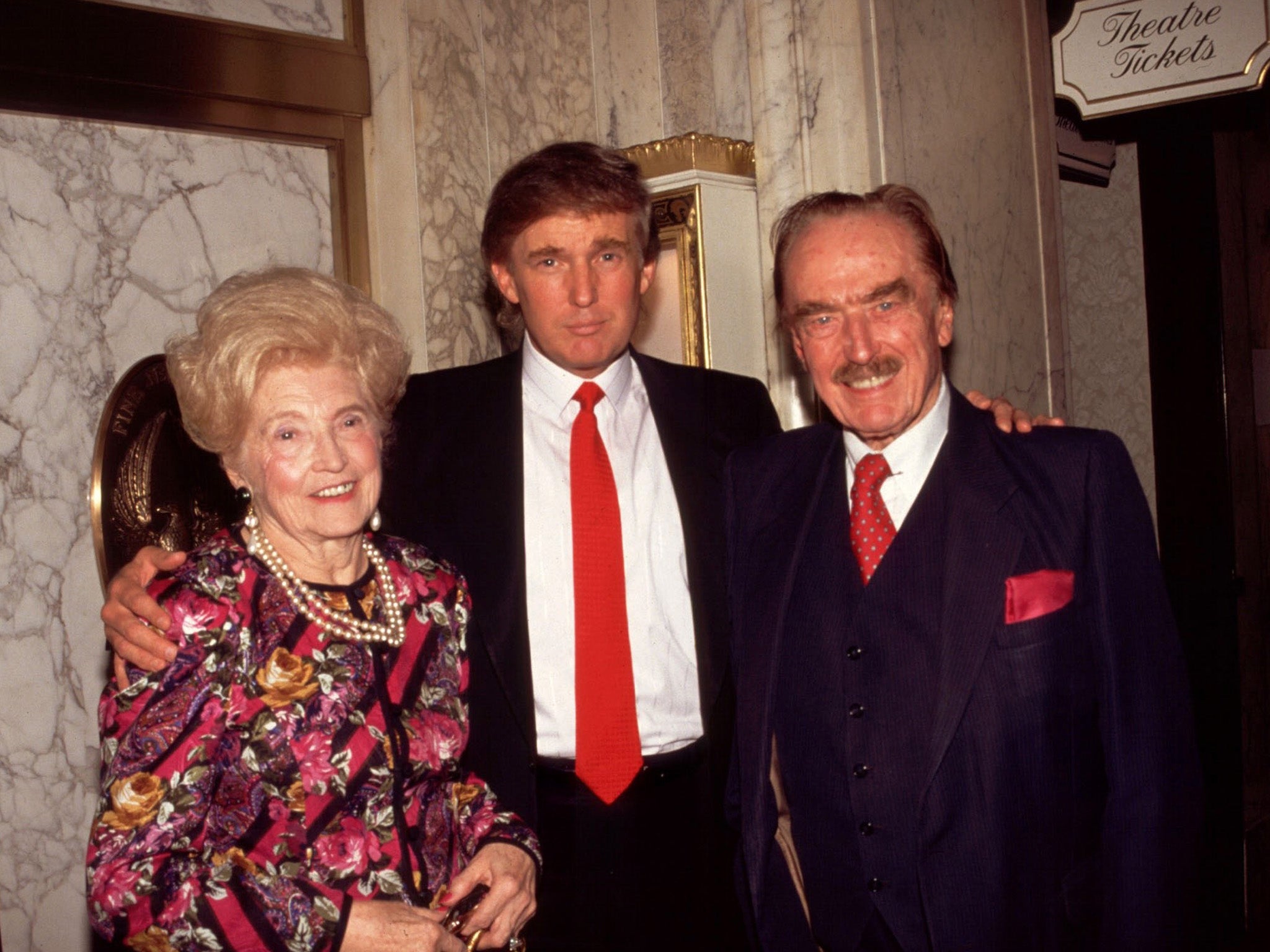 Donald Trump (centre) with his mother Mary and father Fred in New York in 1994