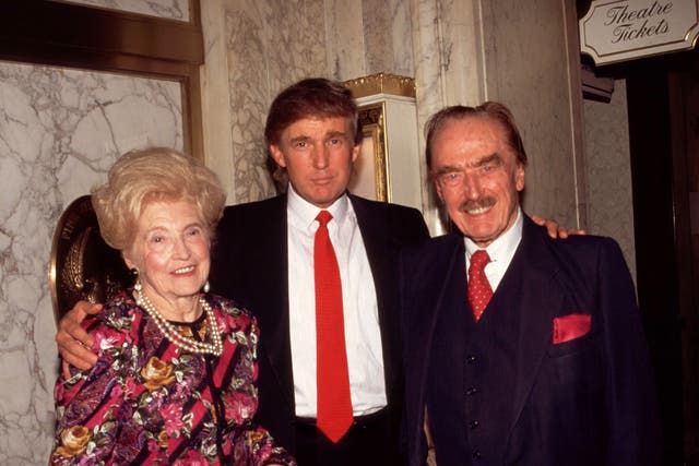 Donald Trump (centre) with his mother Mary and father Fred in New York in 1994
