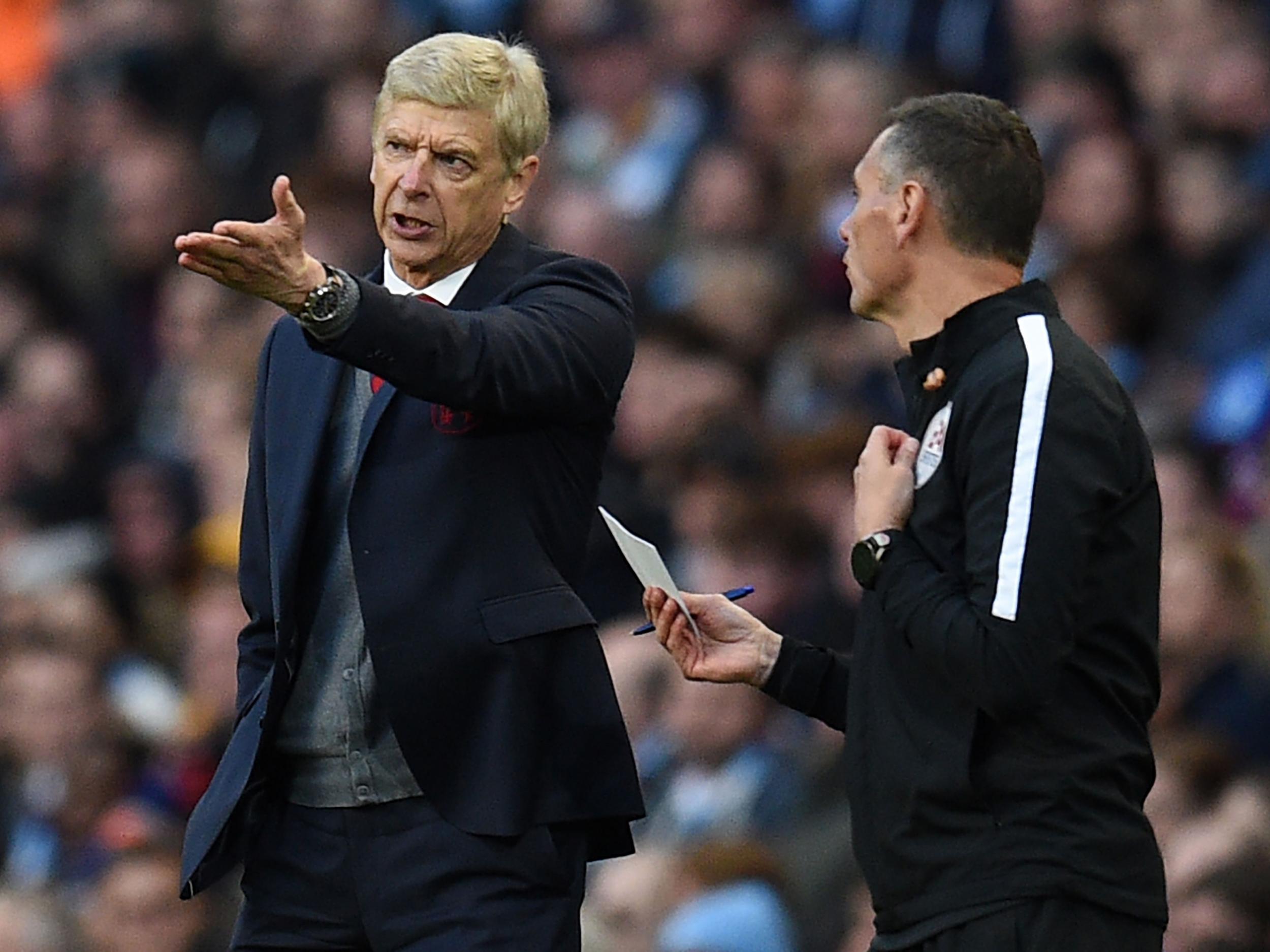Arsene Wenger was left unhappy with referee Michael Oliver's performance