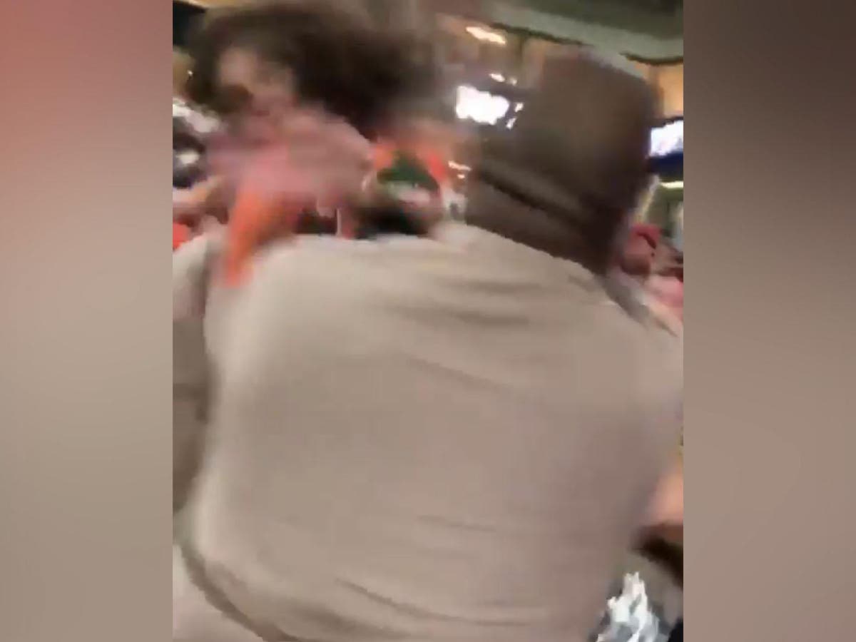 Police officer filmed punching woman at Miami college football game | The  Independent | The Independent