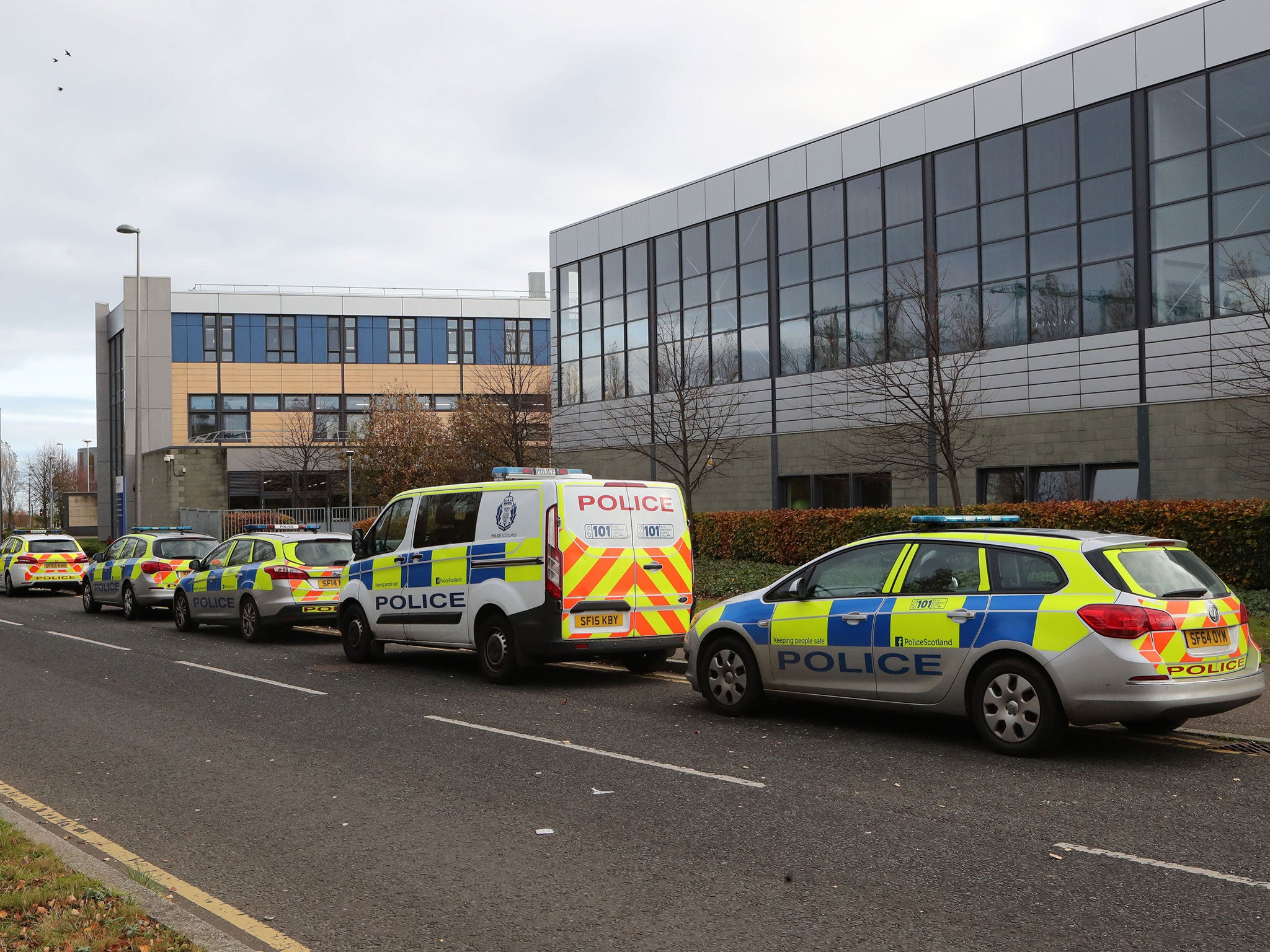 Police vehicles outside Edinburgh College's campus in Granton, where a police officer was stabbed in the back