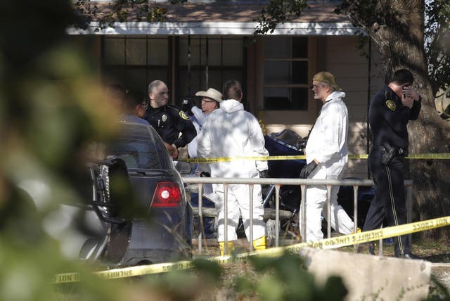 Law enforcement and forensic officials gather near the First Baptist Church following a shooting on November 5, 2017 in Sutherland Springs, Texas