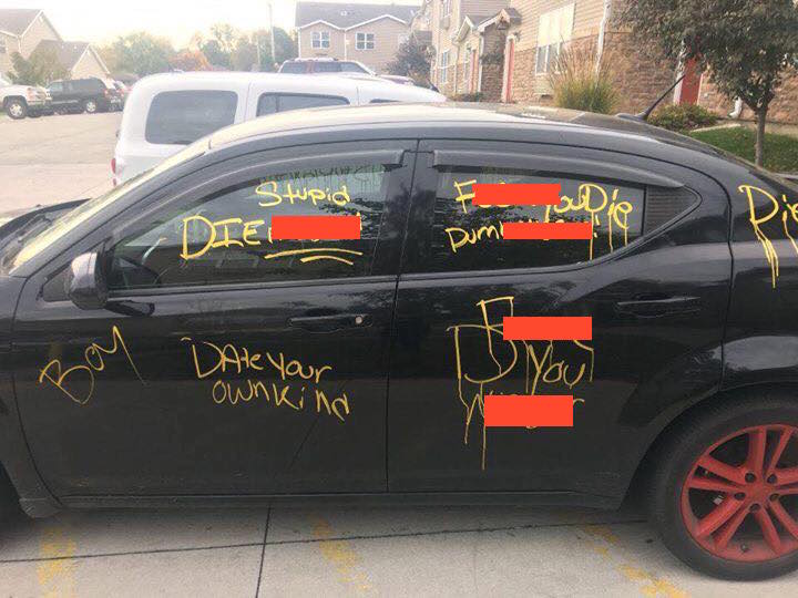 Images posted to social media showed the car covered with racial slurs