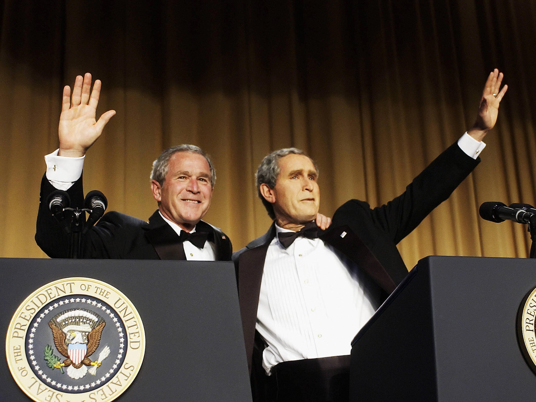 US President George W Bush (left) with impersonator Steve Bridges (right) at the White House Correspondents’ Association Dinner in 2006