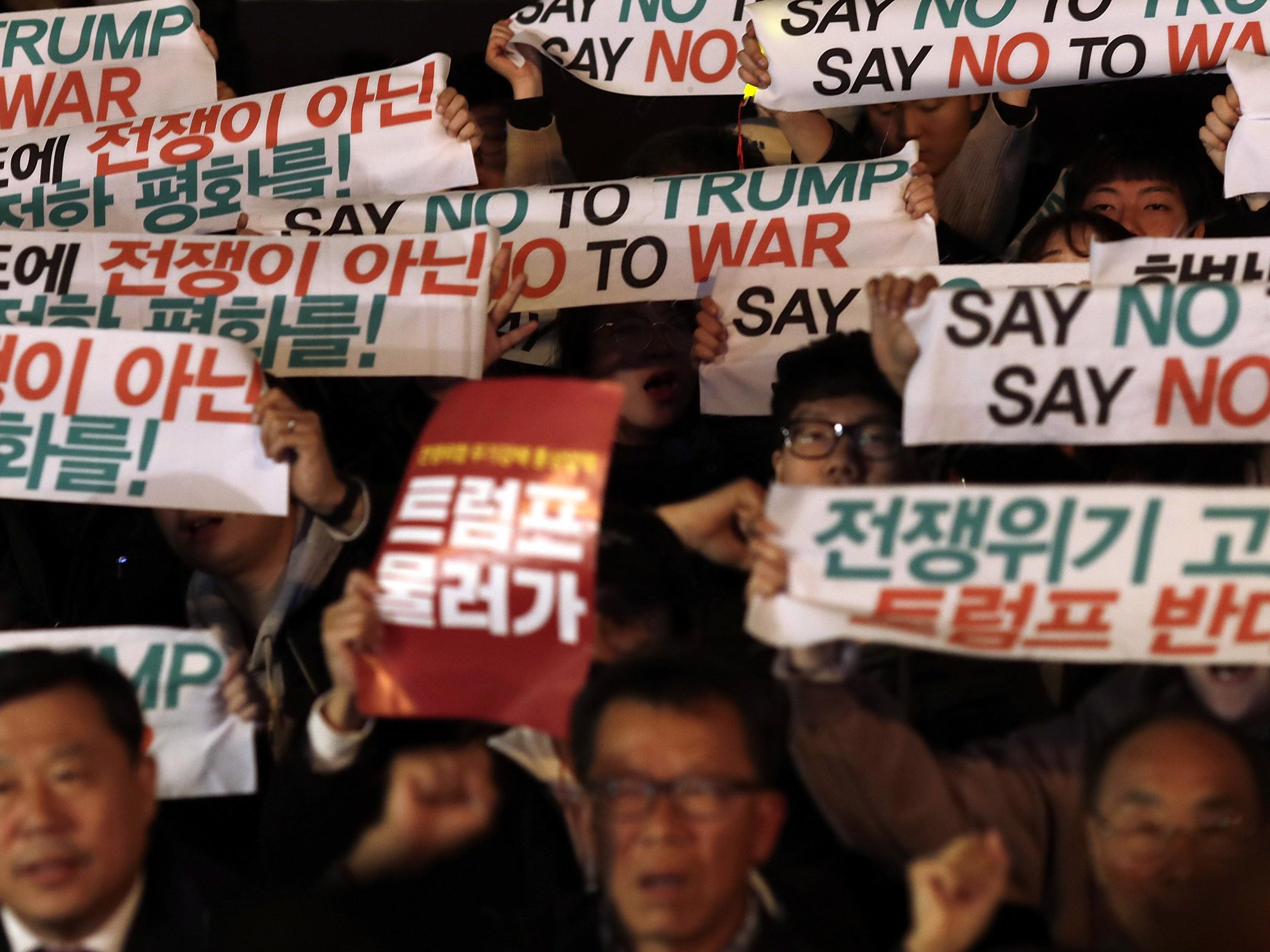 Protesters take part in an anti-Trump rally in front of the US Embassy in Seoul today