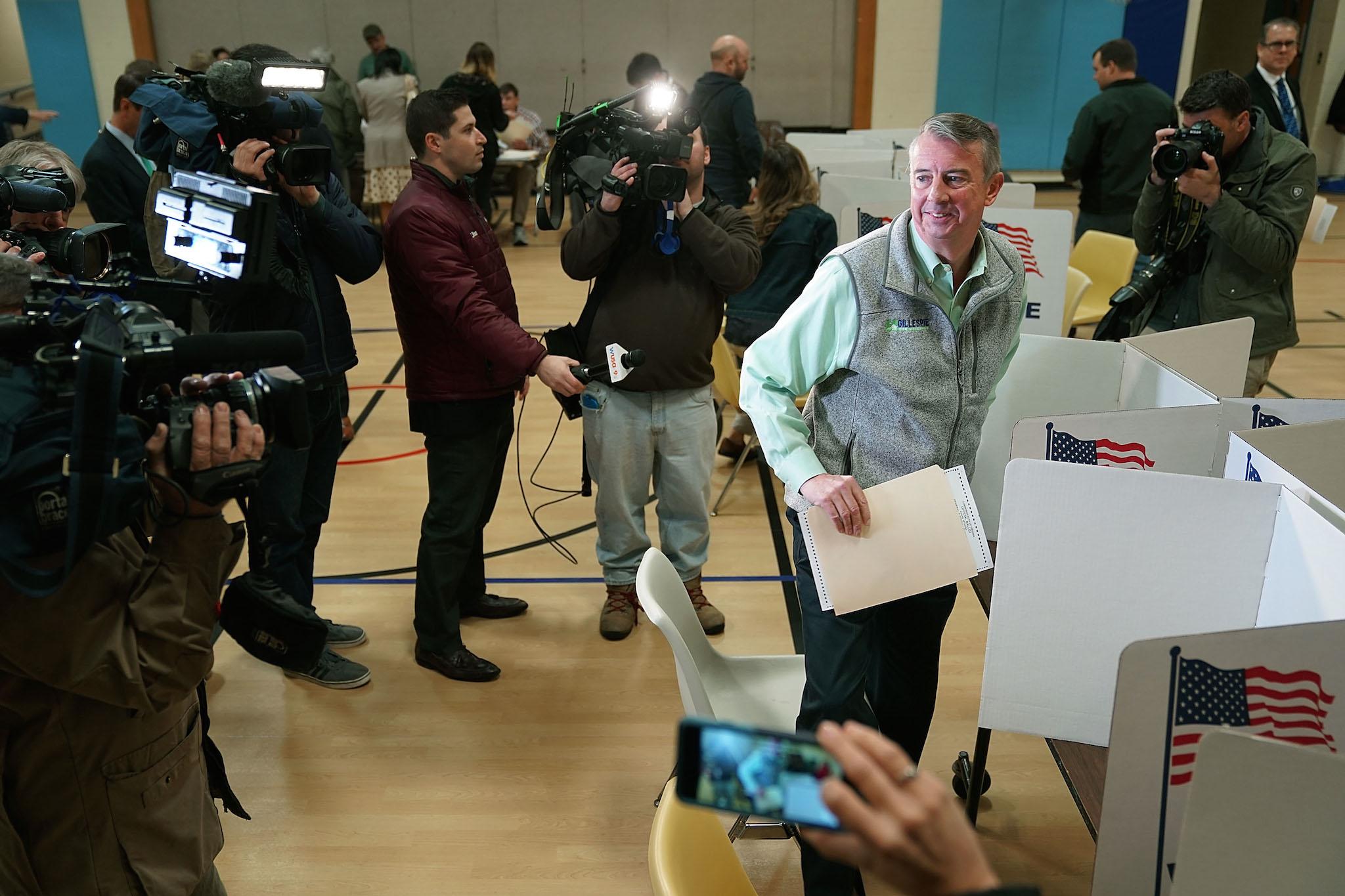 Surrounded by journalists, Republican candidate for Virginia governor Ed Gillespie casts his vote in the gymnasium at Washington Mill Elementary School in Alexandria, Virginia (Photo by Chip Somodevilla/Getty Images)