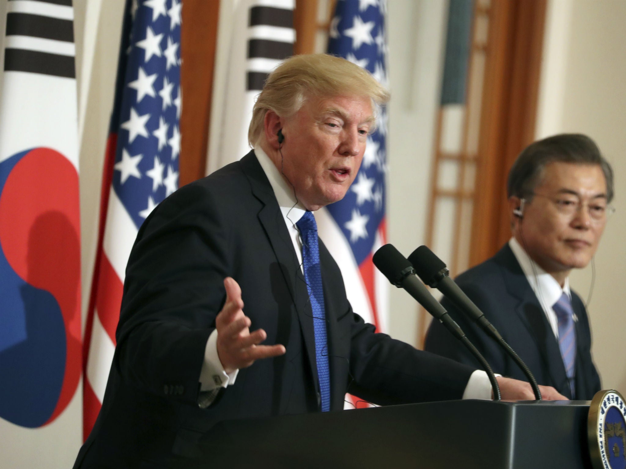 Donald Trump and South Korean President Moon Jae-In shake hands during a joint press conference at the presidential Blue House in Seoul, South Korea on Nov. 7, 2017