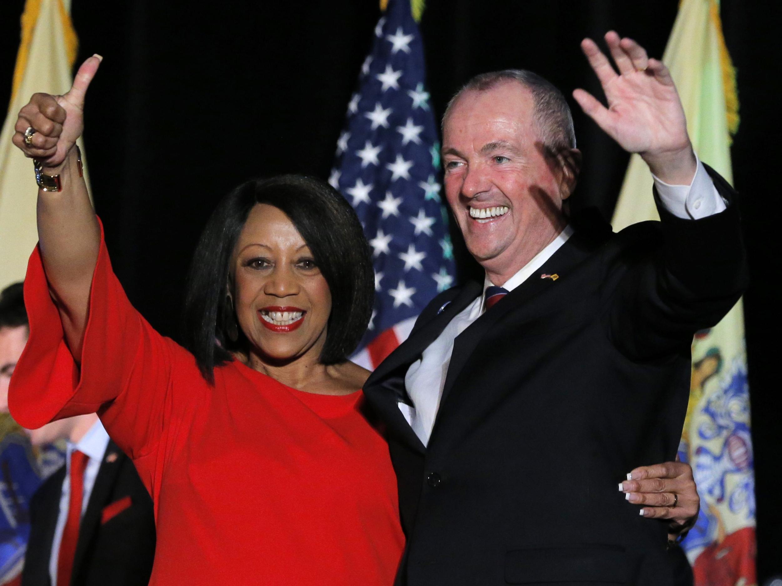 Phil Murphy celebrates with his running mate, Lieutenant Governor-elect Sheila Oliver, after he was elected Governor of New Jersey in Asbury Park