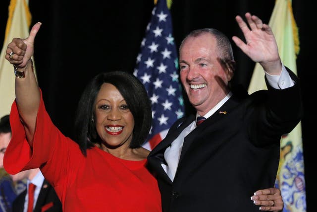 Democratic candidate Phil Murphy celebrates with his running mate, Lieutenant Governor-elect Sheila Oliver, after he was elected Governor of New Jersey in Asbury Park