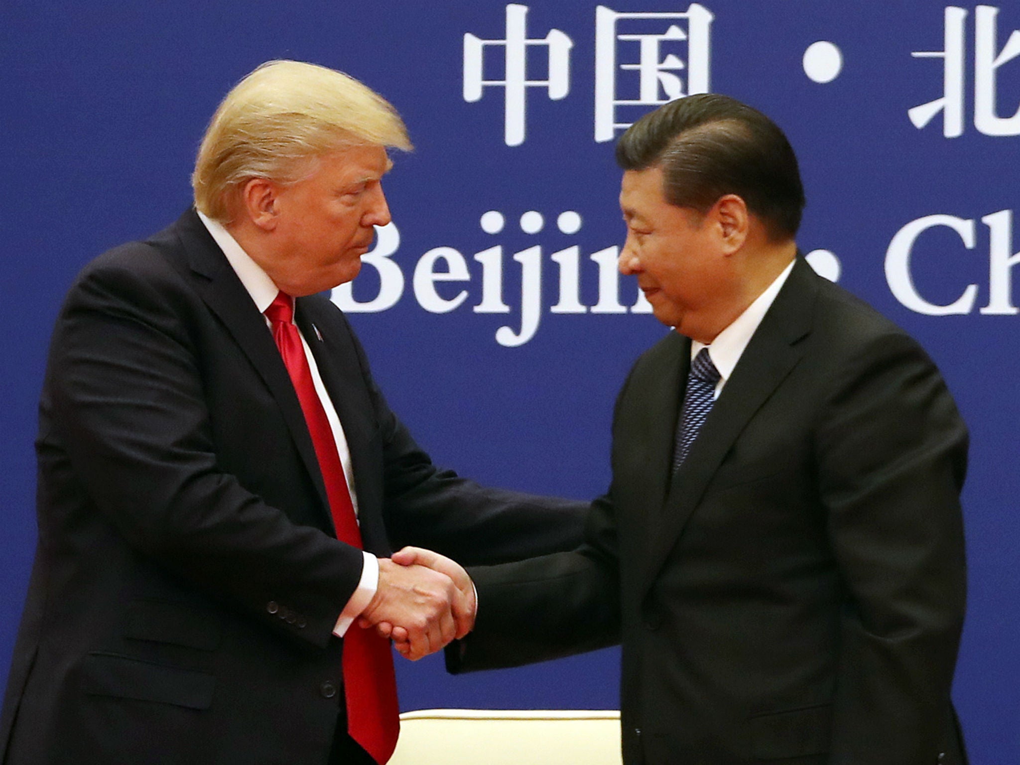 President Donald Trump, left, and Chinese President Xi Jinping during a business event at the Great Hall of the People in Beijing