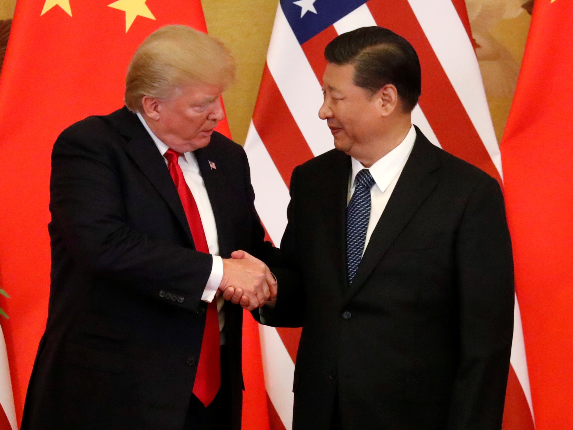 US President Donald Trump and China's President Xi Jinping make joint statements at the Great Hall of the People in Beijing
