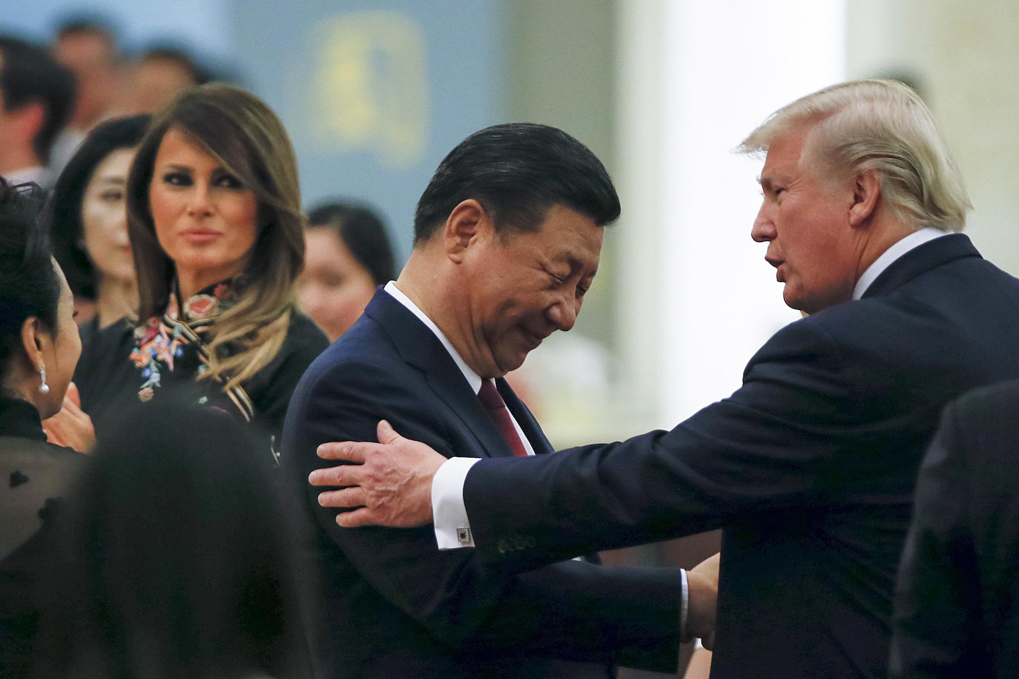 China's President Xi Jinping and US President Donald Trump attend a state dinner in Beijing (Thomas Peter/Pool Photo via AP)