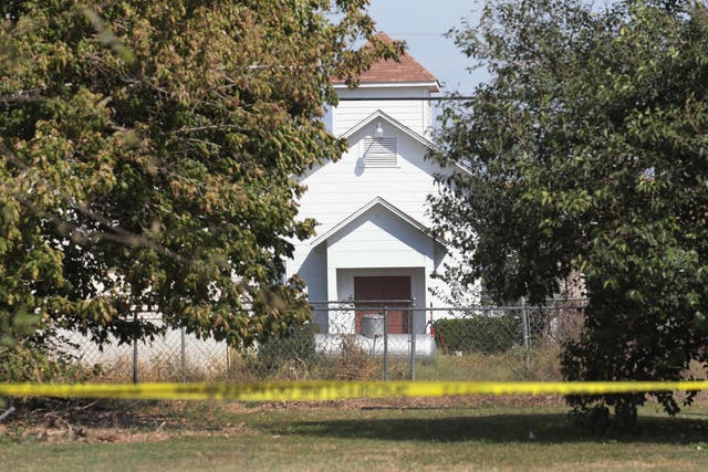 Crime scene tape remains stretched along a road near the First Baptist Church of Sutherland Springs