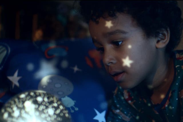 Joe, the main character of the 2017 John Lewis Christmas ad, admires his present from Moz the Monster
