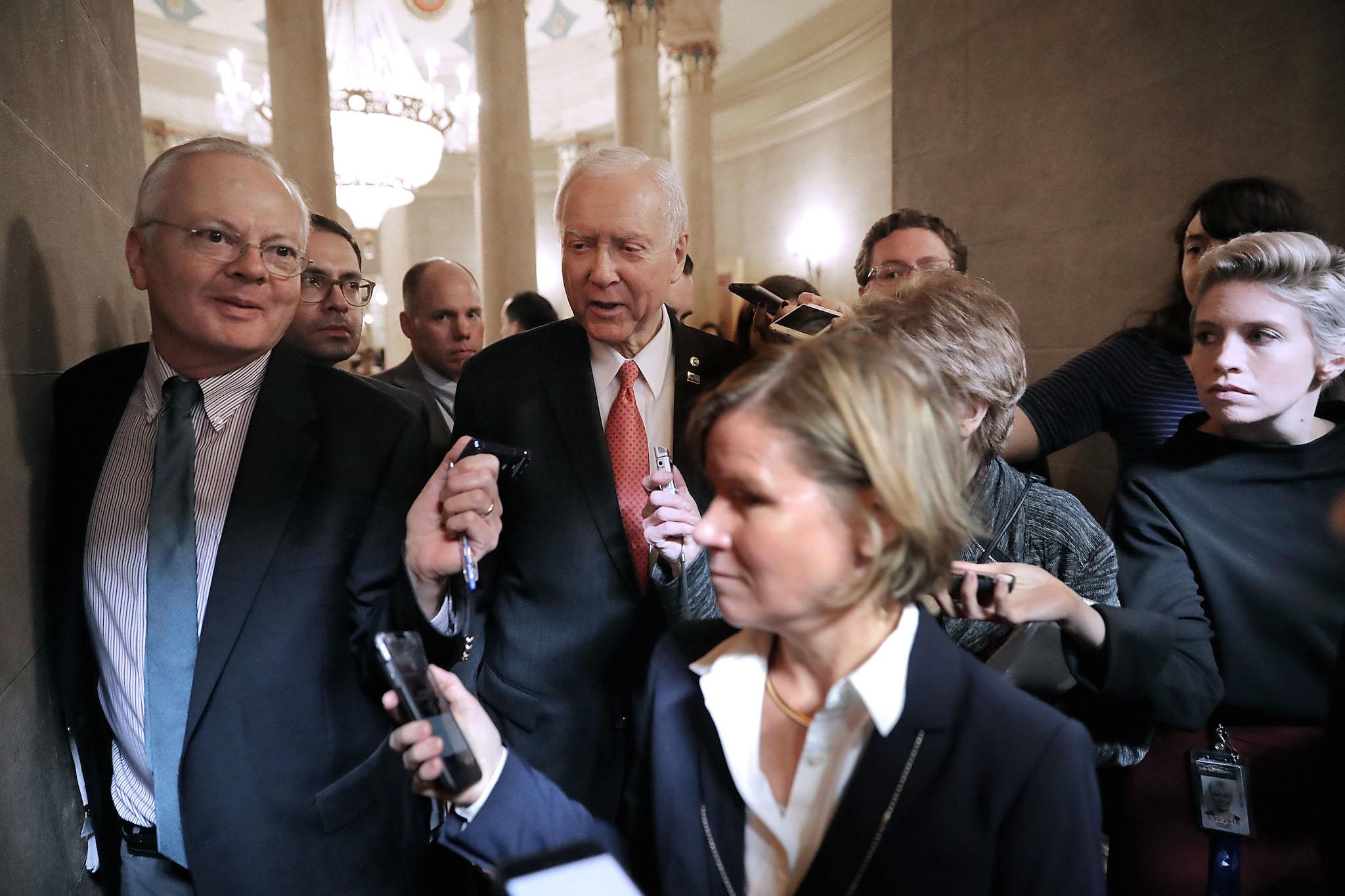 Senate Finance Committee Chairman Orrin Hatch talks with journalists before heading into a tax meeting (Photo by Chip Somodevilla/Getty Images)