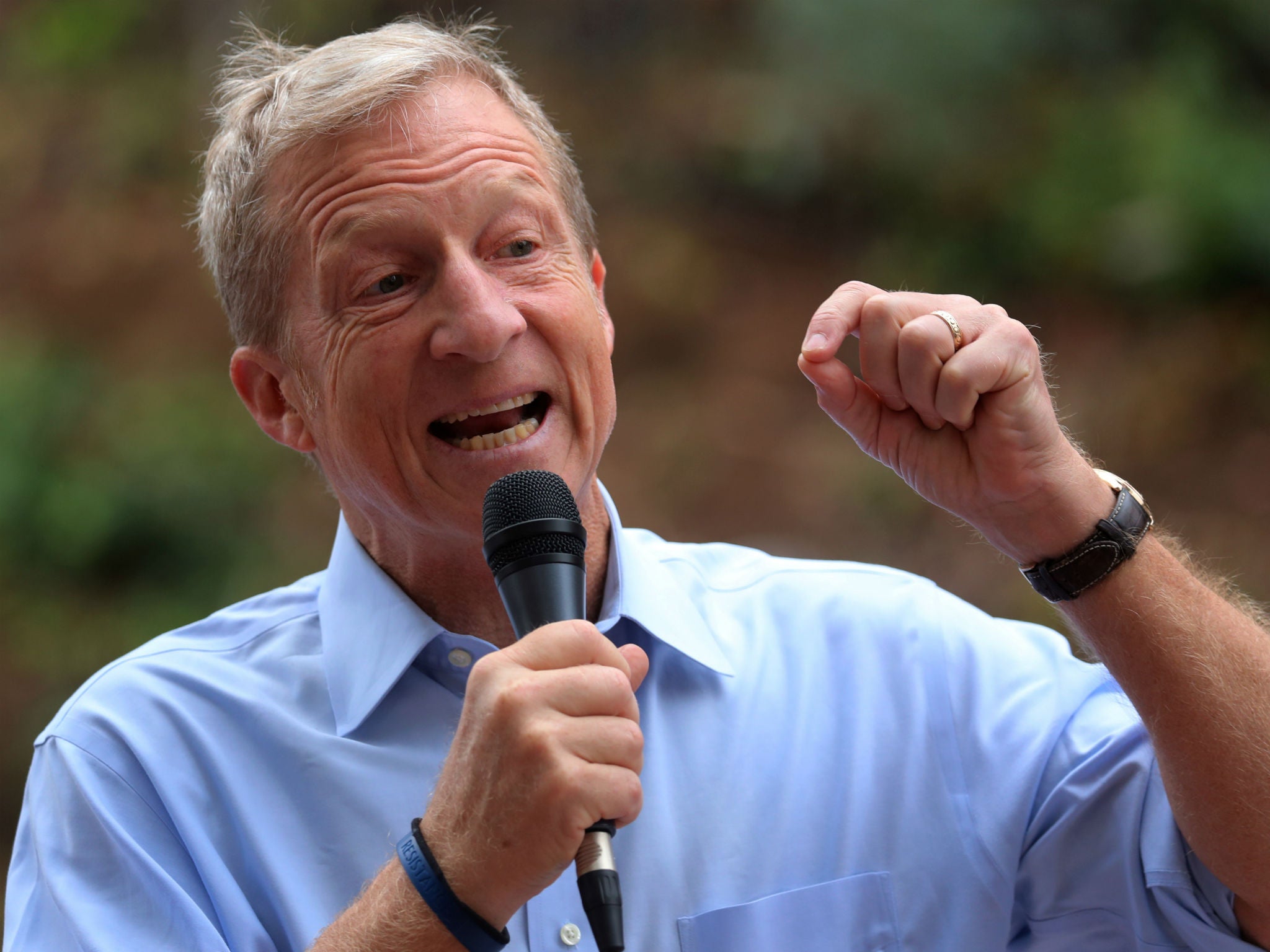 Tom Steyer, seen here at an anti-Donald Trump rally in Vista, California, on October 31, 2017, is spending big on getting Trump out of office