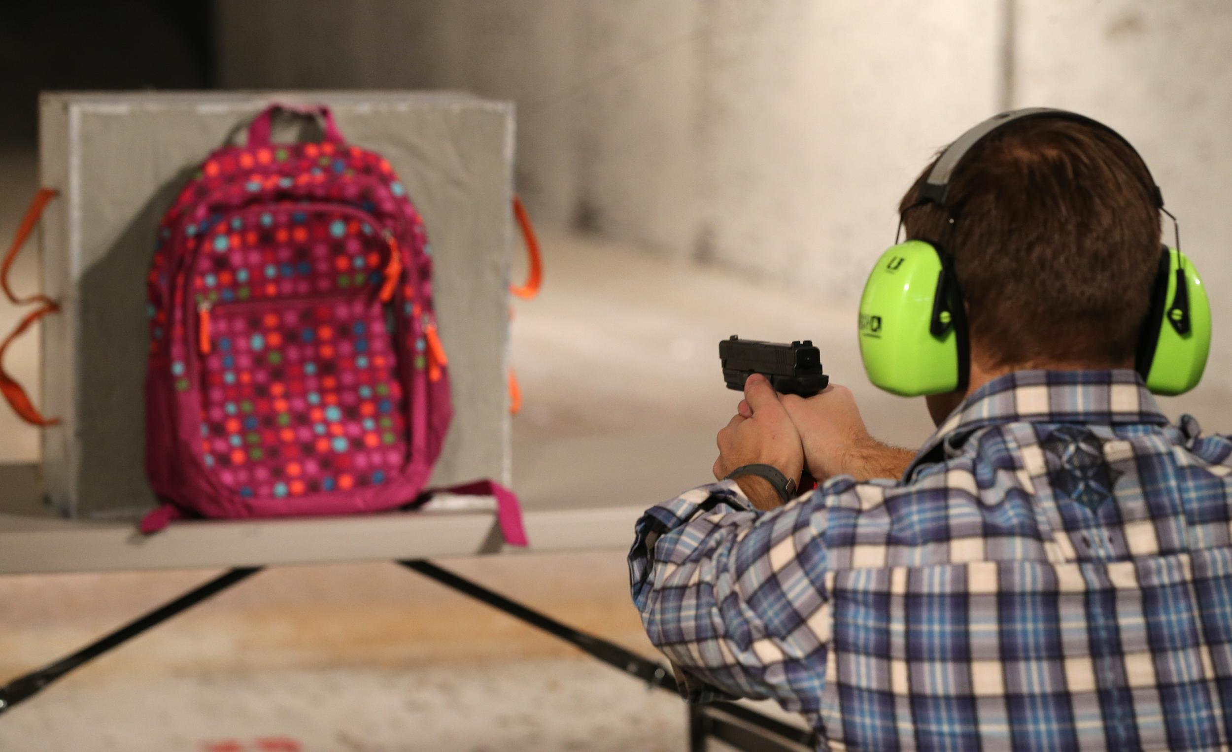 Rich Brand shoots a child's backpack with an Amendment II shield in it, similar to that being offered by a school in Florida