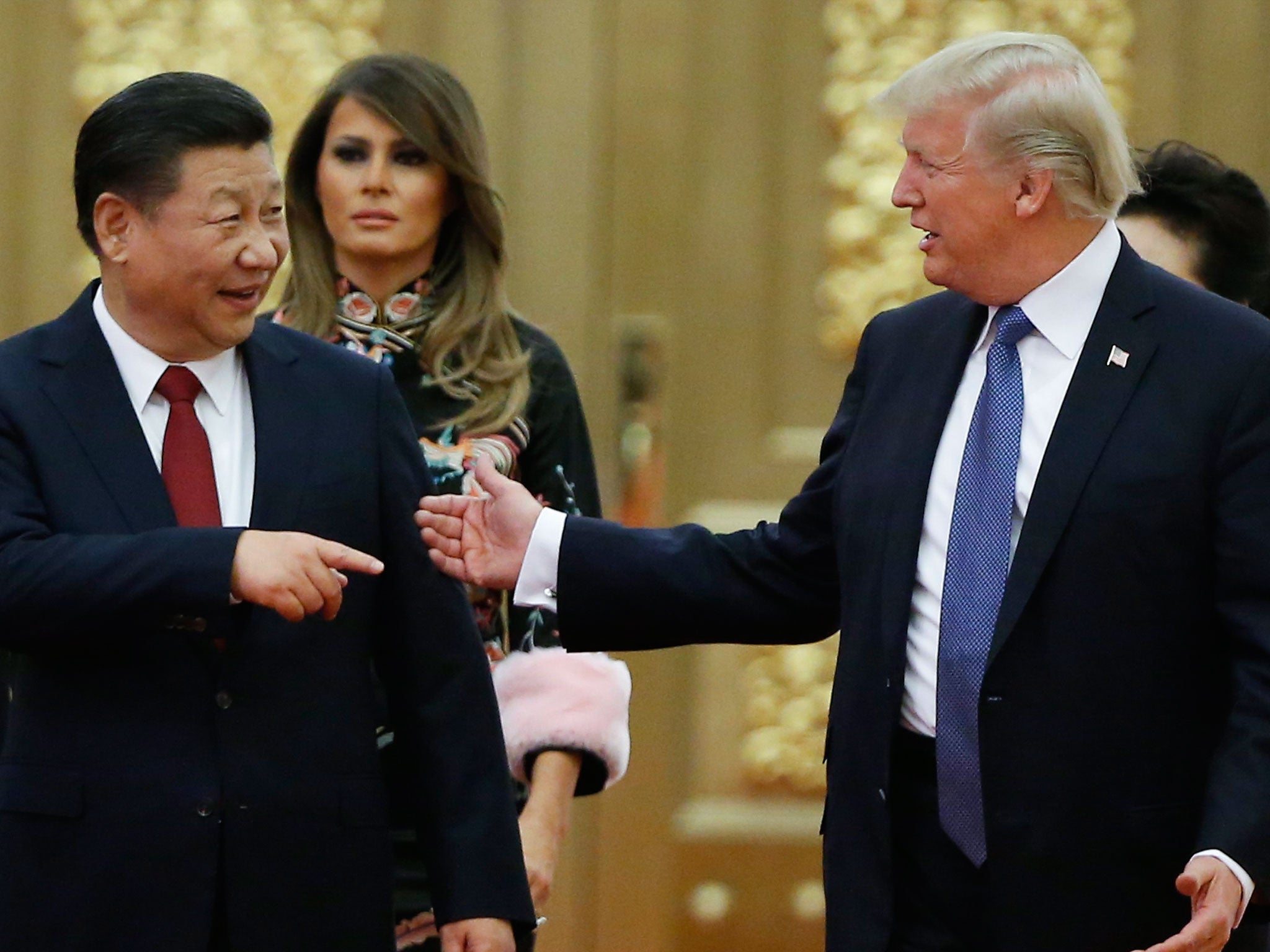 Donald Trump and Xi Jinping arrive at a state dinner at the Great Hall of the People in Beijing