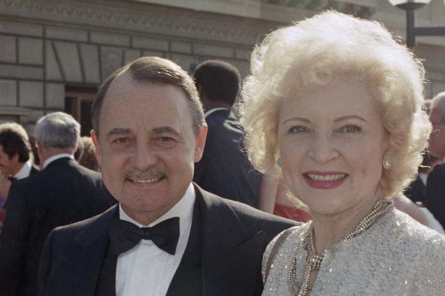 John Hillerman pictured with Betty White the 1985 Emmy Awards in Pasadena, California