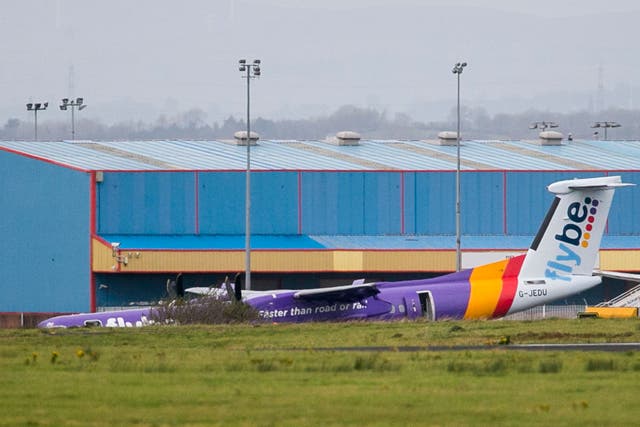 Flybe BE331 on the tarmac after it landed with no nose gear at Belfast International Airport.