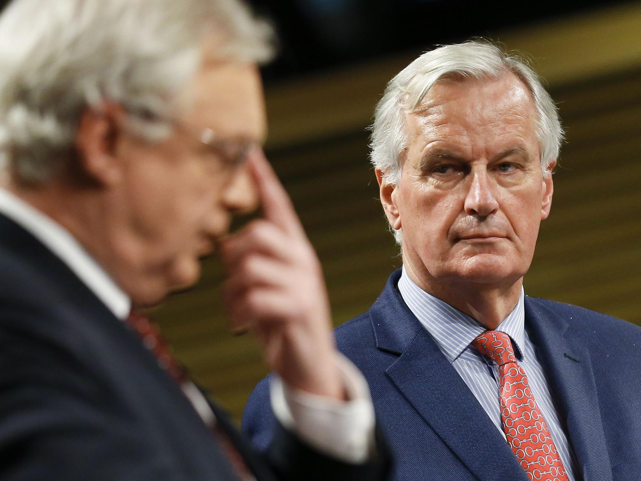 Michel Barnier watches Brexit Secretary David Davis at a meeting earlier this year
