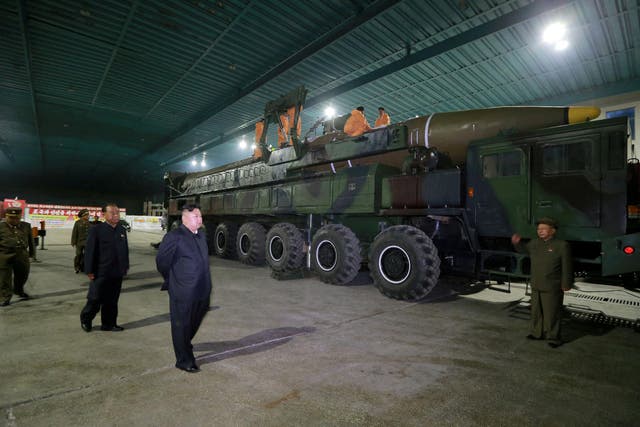 North Korean leader Kim Jong-un inspects an intercontinental ballistic missile