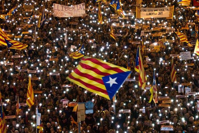 Demonstrators gather during a protest calling for the release of Catalan jailed politicians in Barcelona; hundreds of thousands were said to have attended