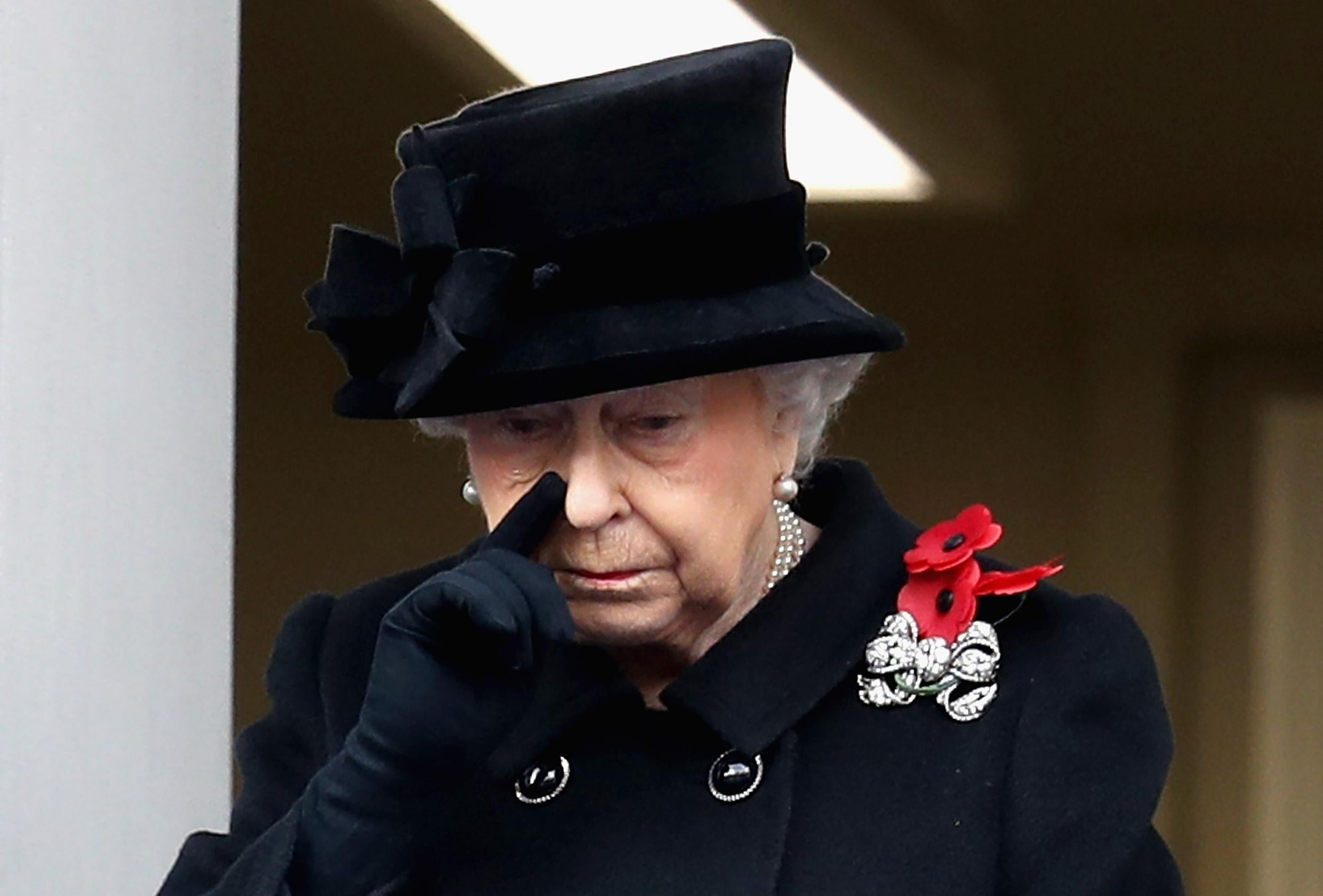 The Queen appeared to shed a tear as she watched the service from a balcony (Getty)