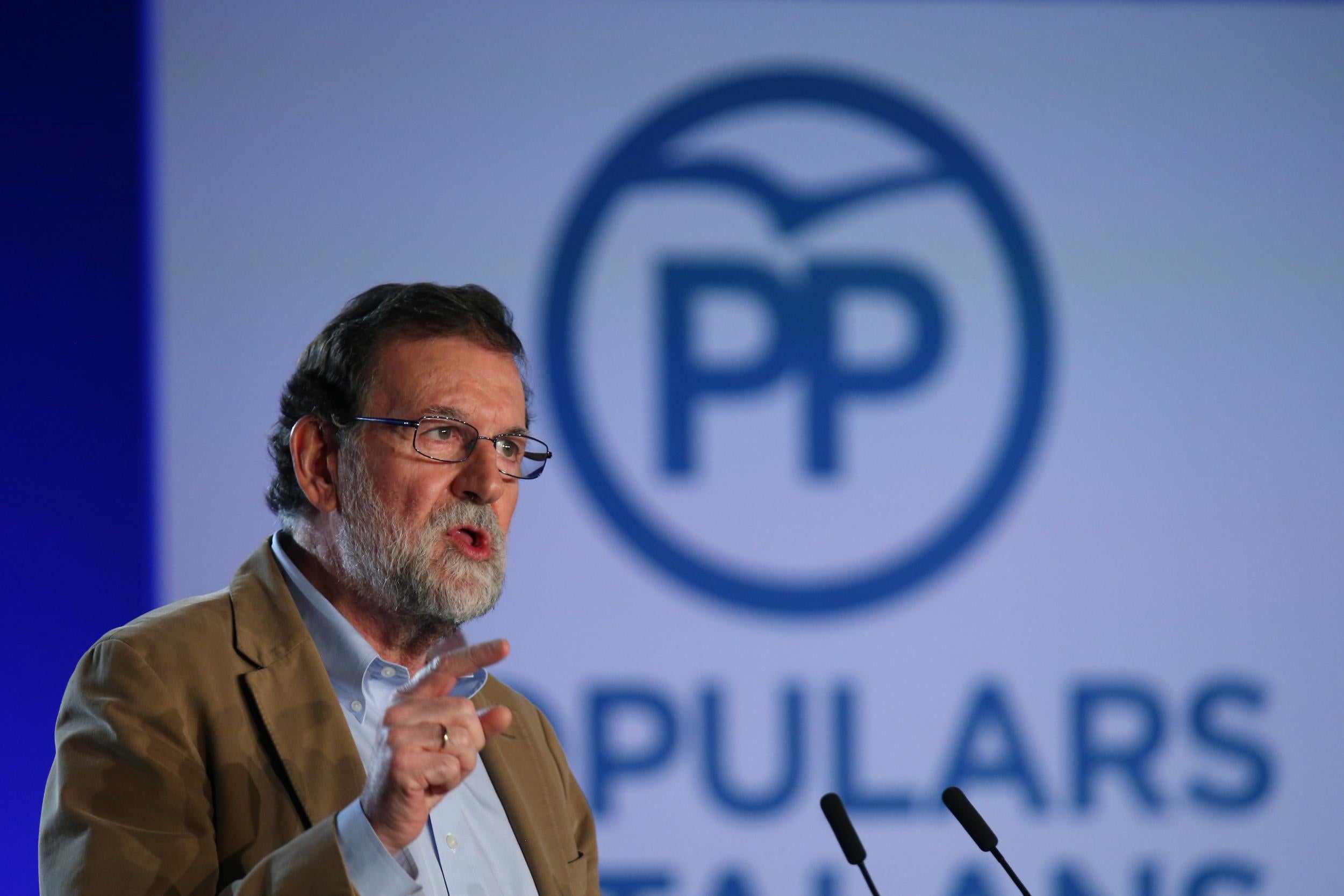 Spanish Prime Minister Mariano Rajoy speaks at a Catalan regional People's Party meeting in Barcelona...