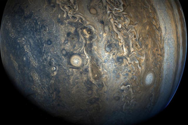 An image taken by the Nasa probe Juno shows the 'String of Pearls', one of Jupiter's eight massive rotating storms