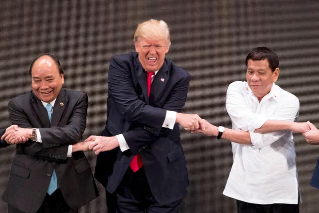 US President Donald Trump with Vietnamese Prime Minister Nguyen Xuan Phuc, left, and Philippine President Rodrigo Duterte