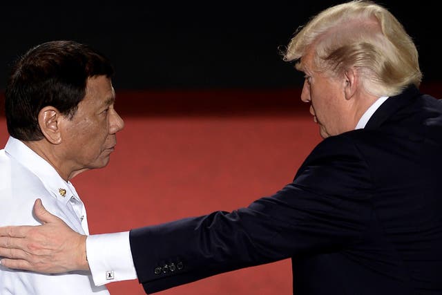 Mr Trump greets Mr Duterte during the ASEAN conference in Manila