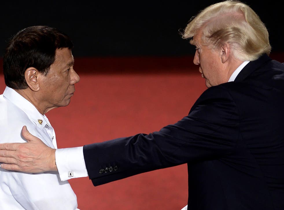 Mr Trump greets Mr Duterte during the ASEAN conference in Manila