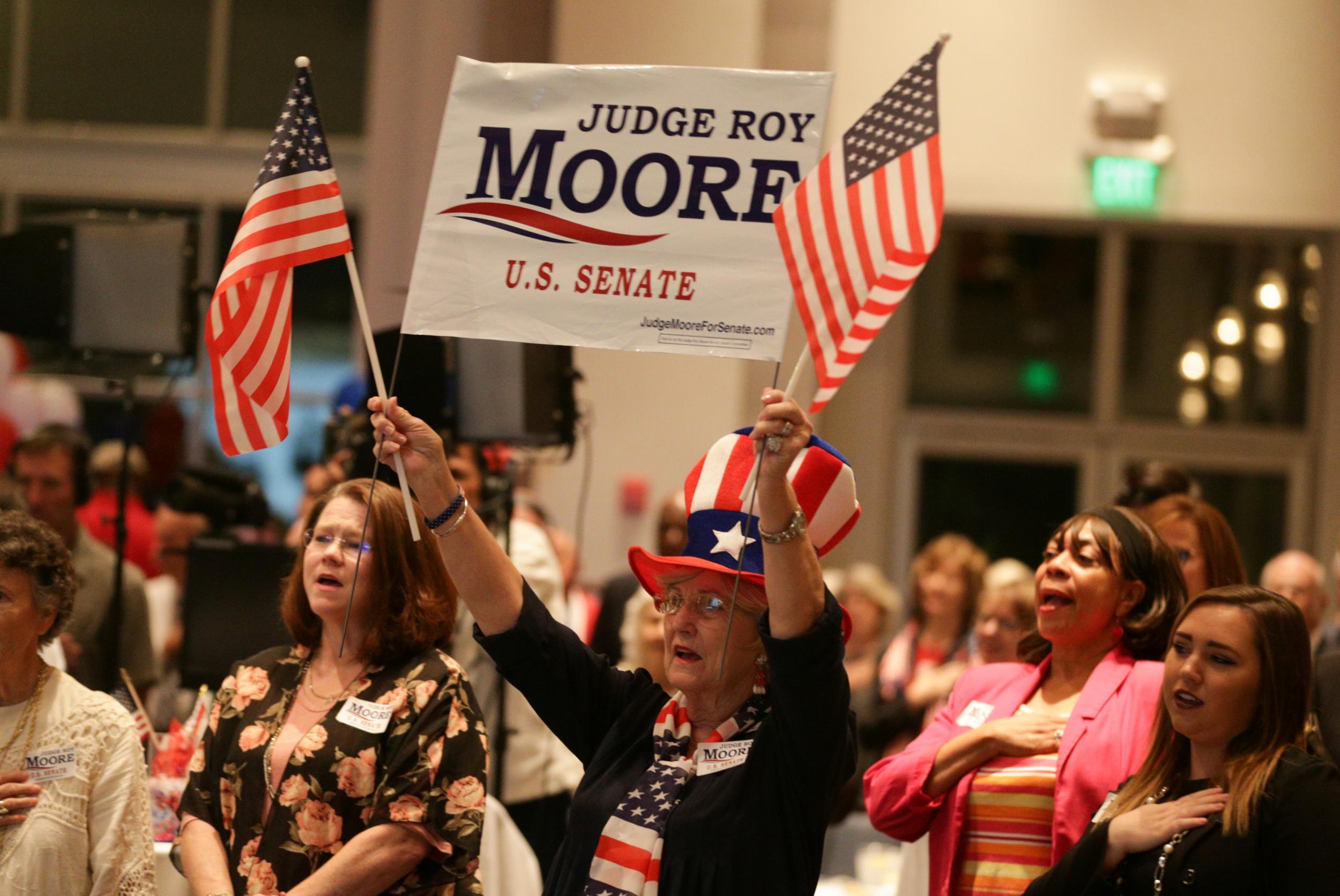Moore's supporters include hardcore Christian conservatives