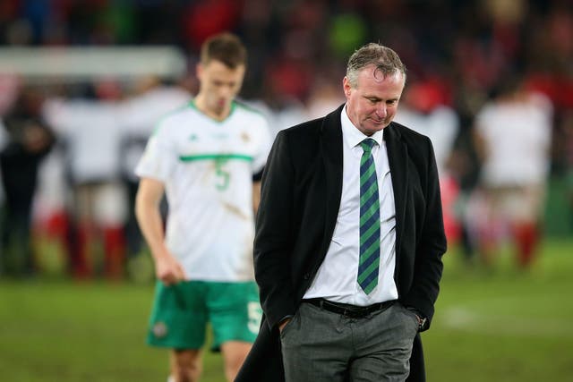 Michael O'Neill looks on after his side's failure to qualify for next summer's World Cup