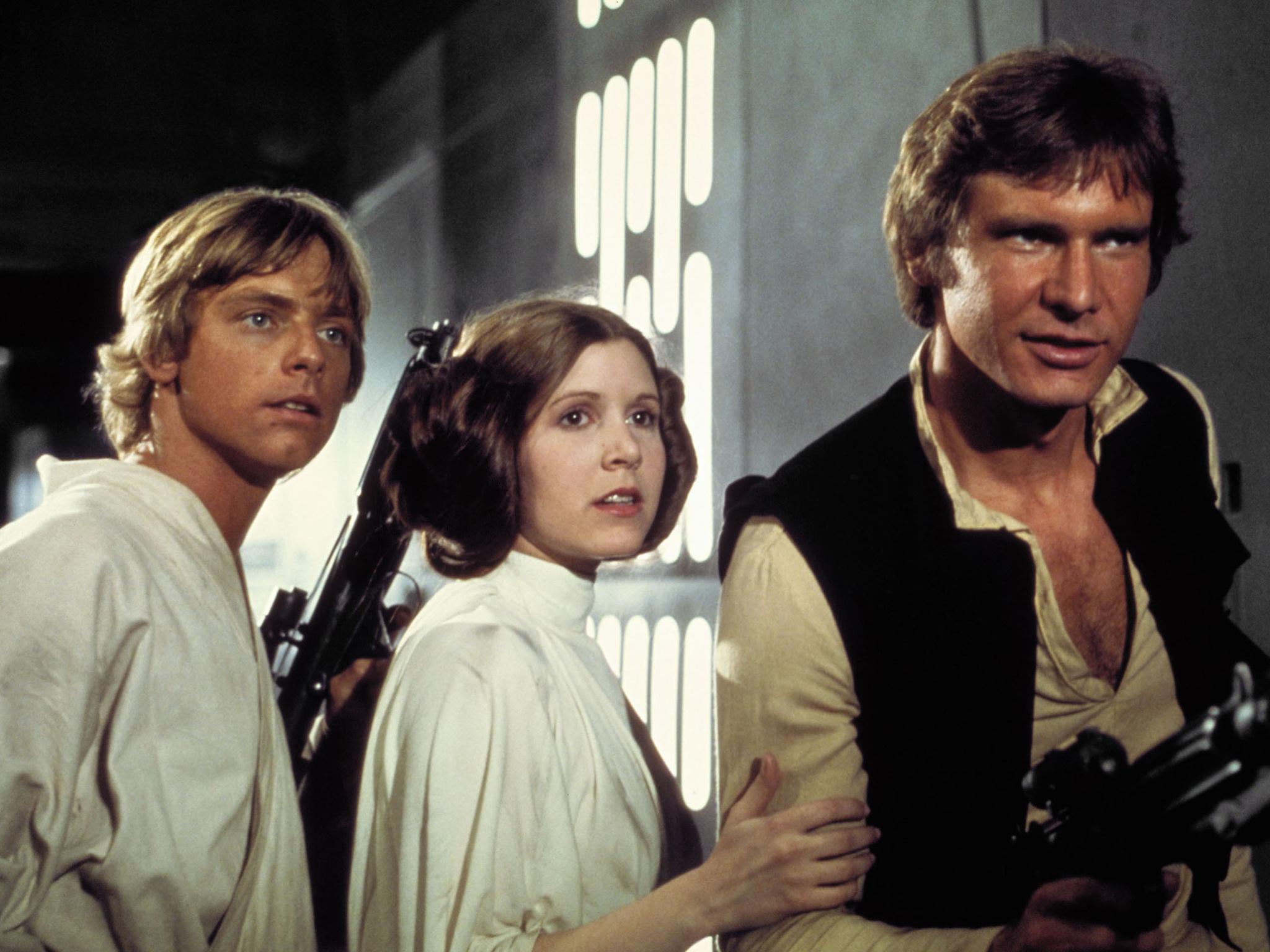 Hamill, Carrie Fisher, and Harrison Ford in 'Star Wars Episode IV - A New Hope' in 1977