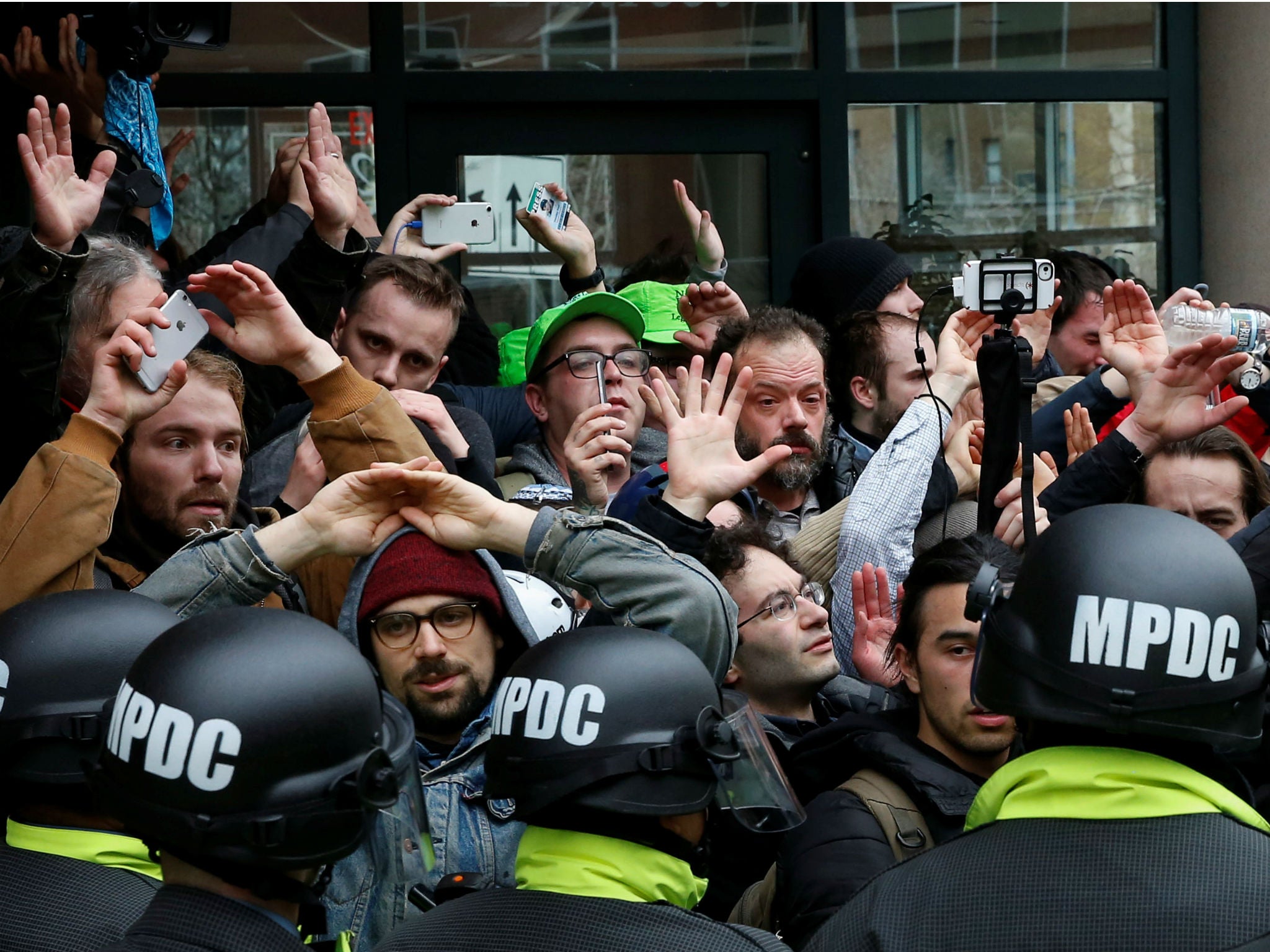 Protesters demonstrating against Donald Trump are surrounded by police on the sidelines of the inauguration in Washington, DC on January 20, 2017