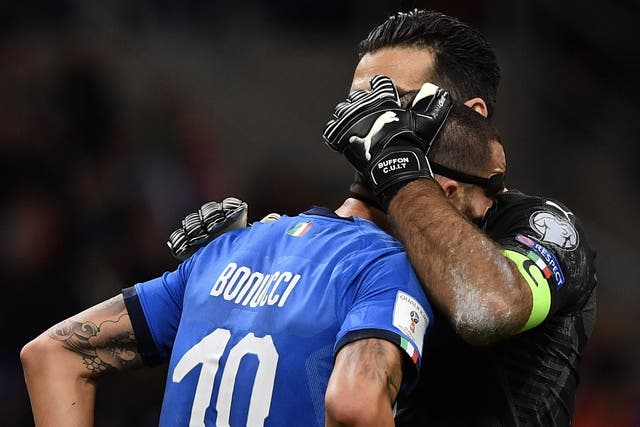 Gianluigi Buffon consoles Leonardo Bonucci after the final whistle