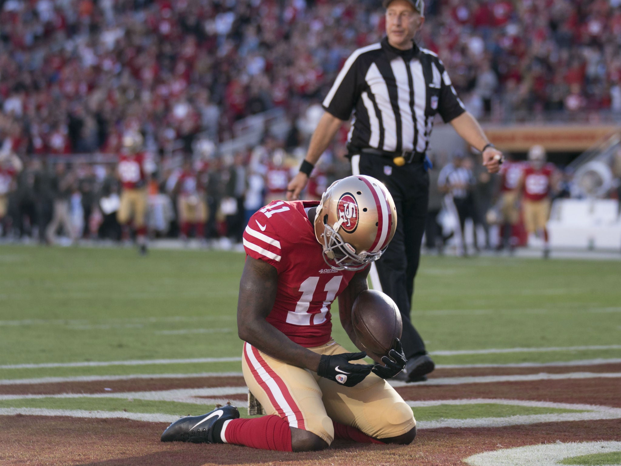 Marquise Goodwin celebrates after scoring a touchdown just hours after the death of his child, on November 12, 2017 in Santa Clara, California