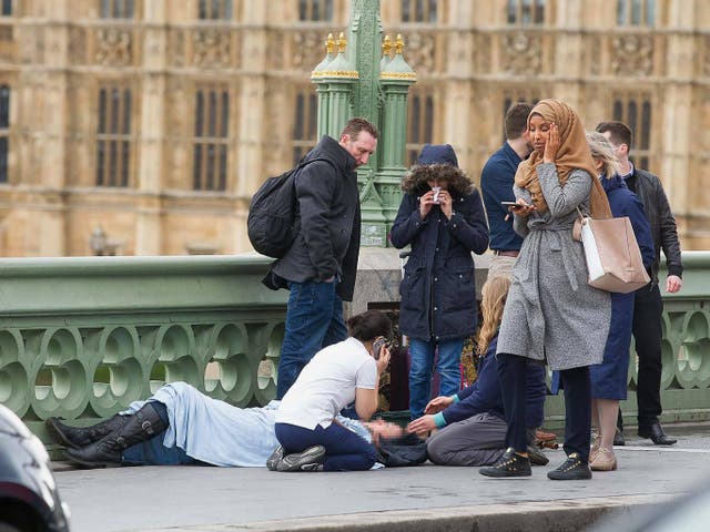 The woman was photographed on the bridge the day of the attack and was attacked by far-right trolls