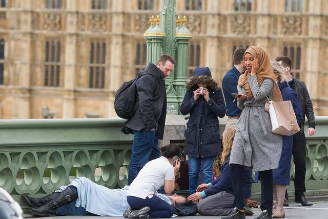 The woman was photographed on the bridge the day of the attack and was attacked by far-right trolls