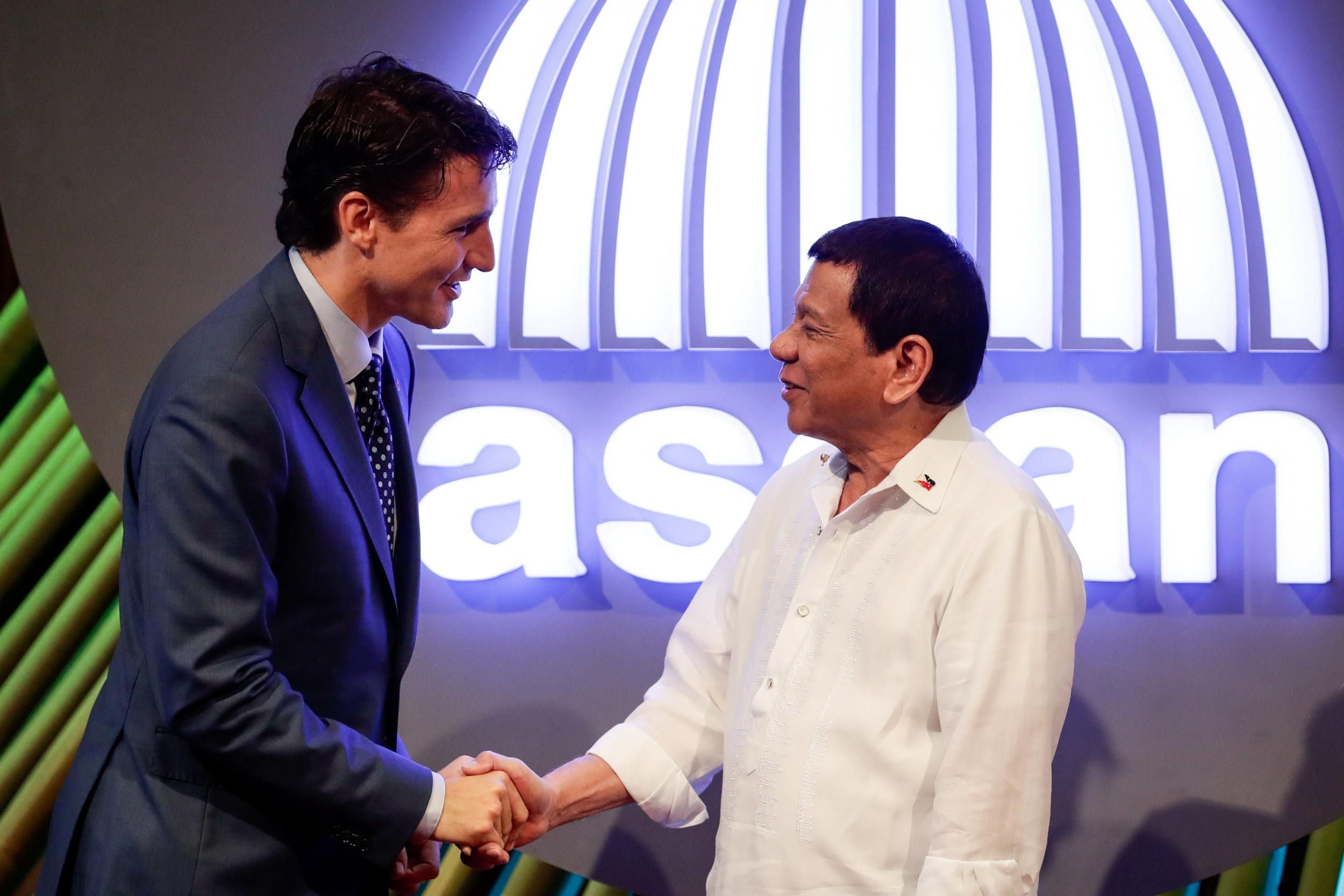 Canadian Prime Minister Justin Trudeau shakes hands with Philippine President Rodrigo Duterte before the opening ceremony of the 31st Association of Southeast Asian Nations (ASEAN) Summit in Manila