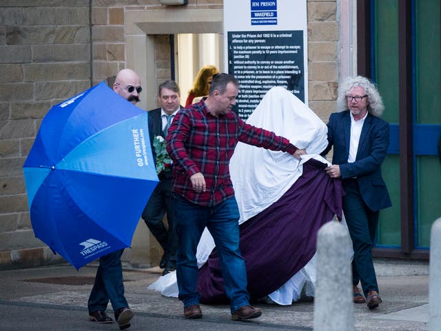 Paula Williamson leaves Wakefield prison covered with blankets after marrying Charles Bronson