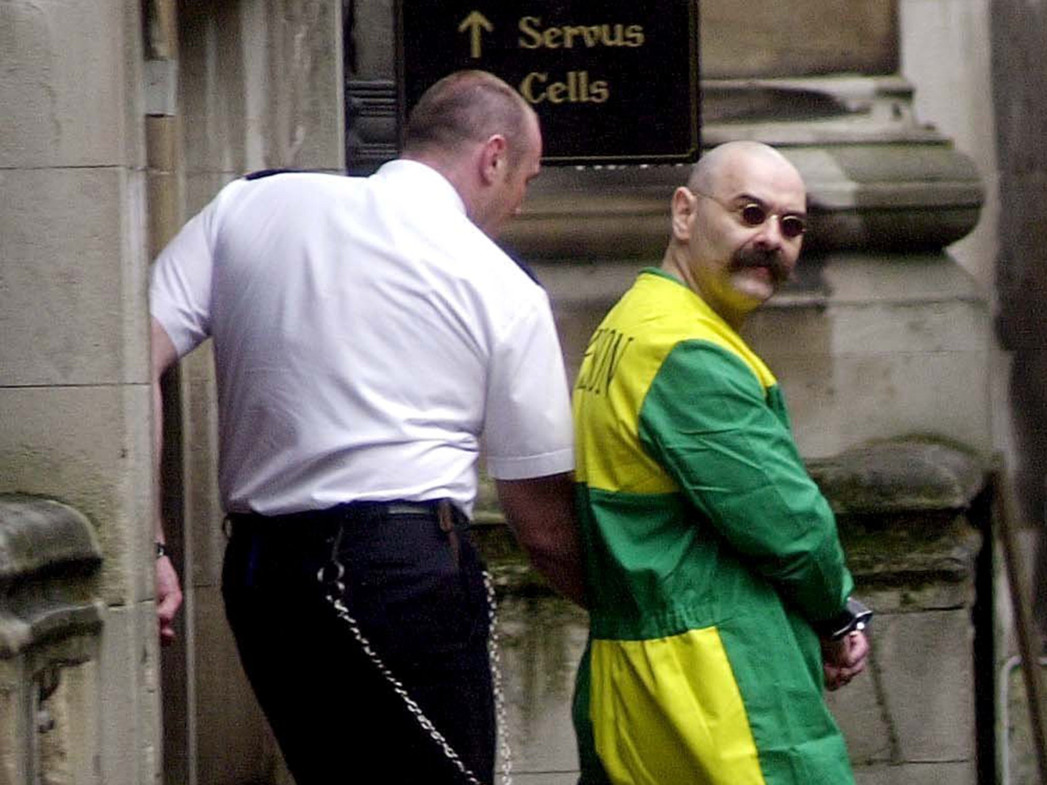 Charles Bronson, pictured outside Woodhill Prison chapel in 2001, is alleged to have attacked a governor at HMP Wakefield