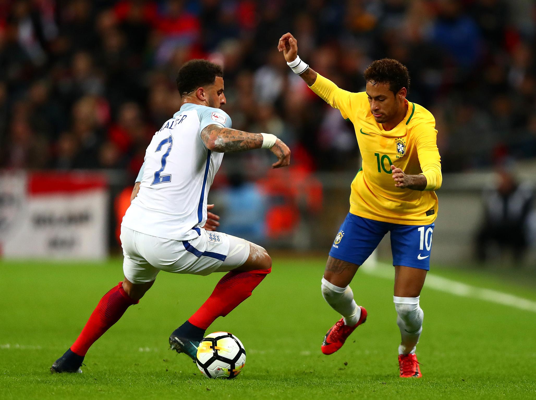 Neymar, right, takes on England wing-back Kyle Walker